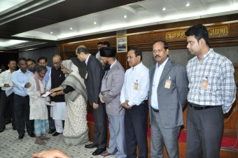 The Prime Minister handed over cheques of Tk 7 lakh to each Tazreen Fashions fire victim